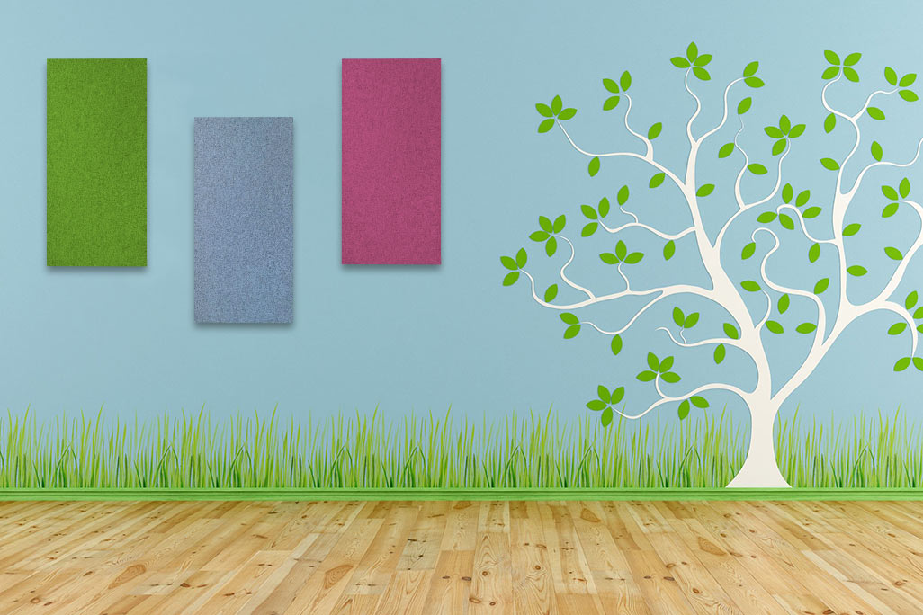 Blue wall with a painted tree with small green leaves, next to it are 3 rectangular acoustic elements in light green, blue and pink