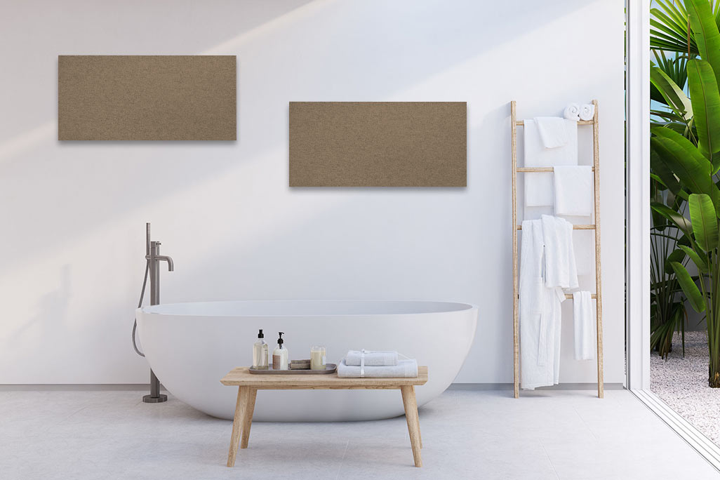 Bright bathroom with a white bathtub and a white wall with two rectangular acoustic elements in beige.