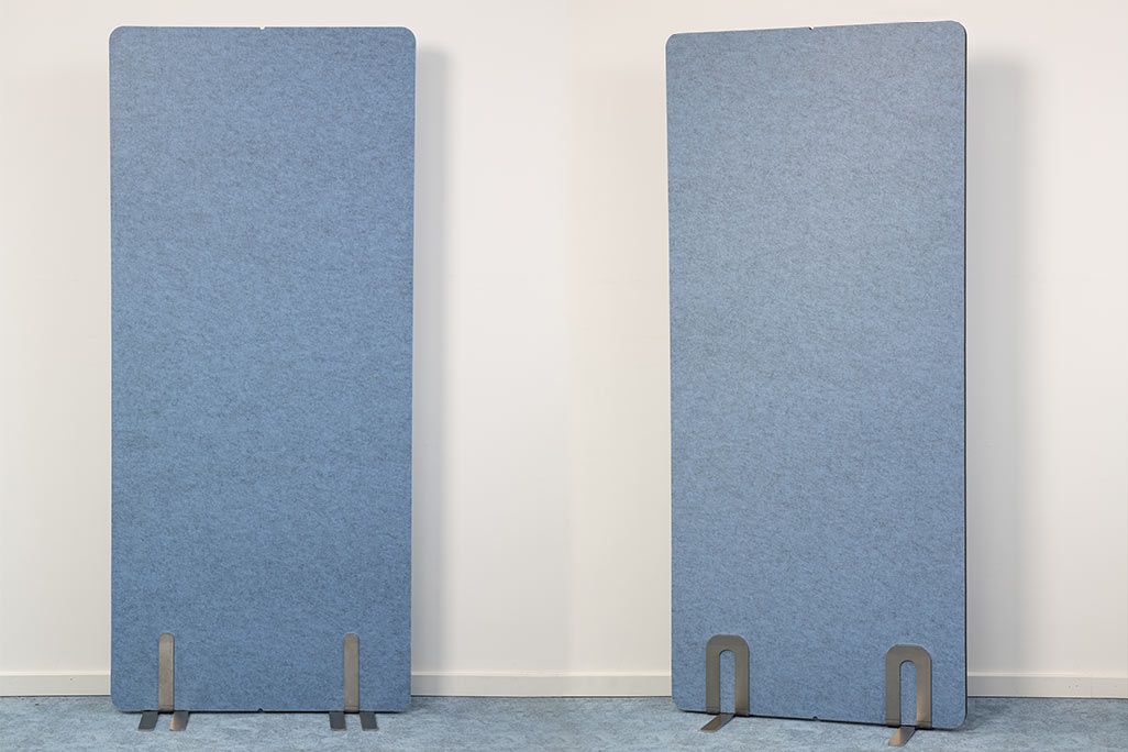 2 soniflex screens next to each other in front of a white wall, color blue