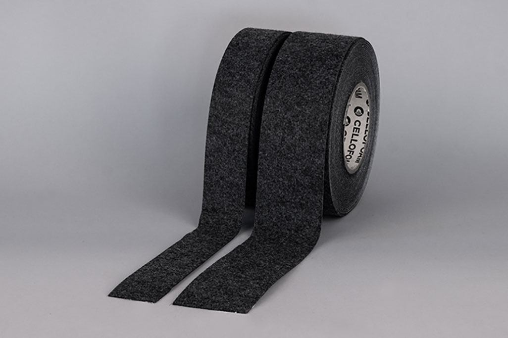soni Klebeband VLD - Anthrazit 2 rolls of VLD felt adhesive tape photographed side by side against a gray background, anthracite color