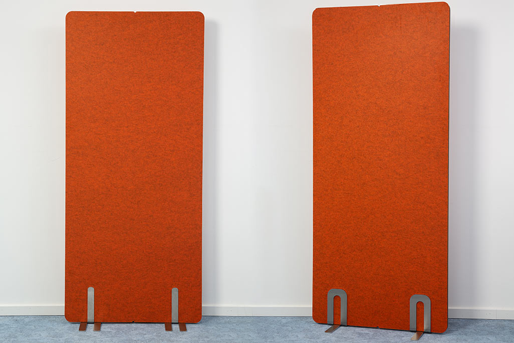 2 partitions from soniflex next to each other in front of a white wall, color orange
