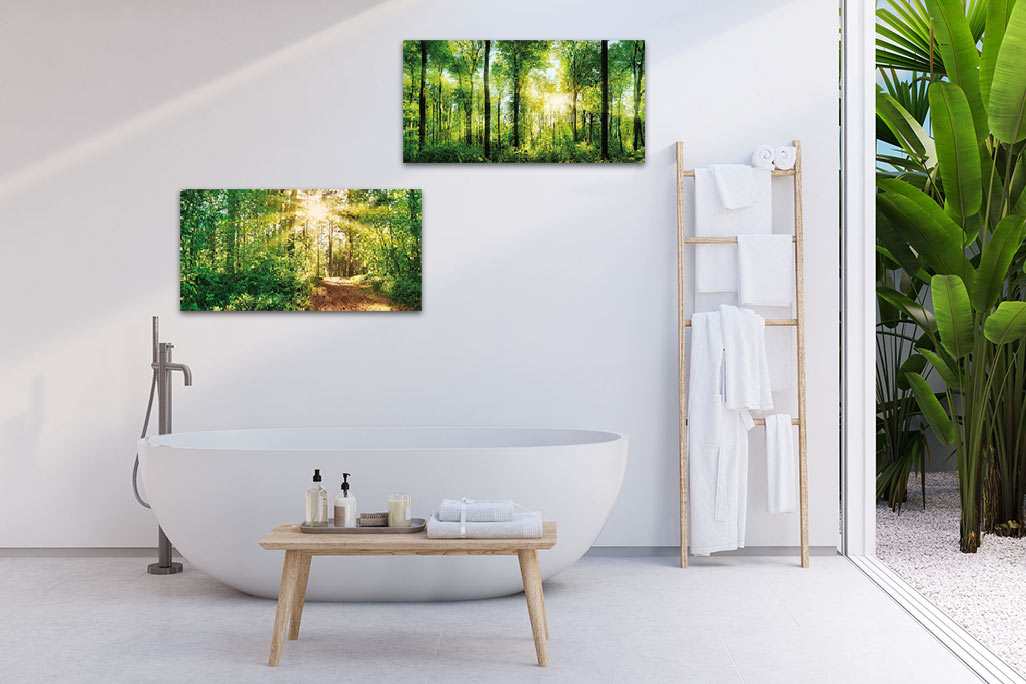 soni PICTURE sundrenched forest & forest trail Bright bathroom with a white bathtub and a white wall on which two acoustic pictures sonif PICTURE are mounted.