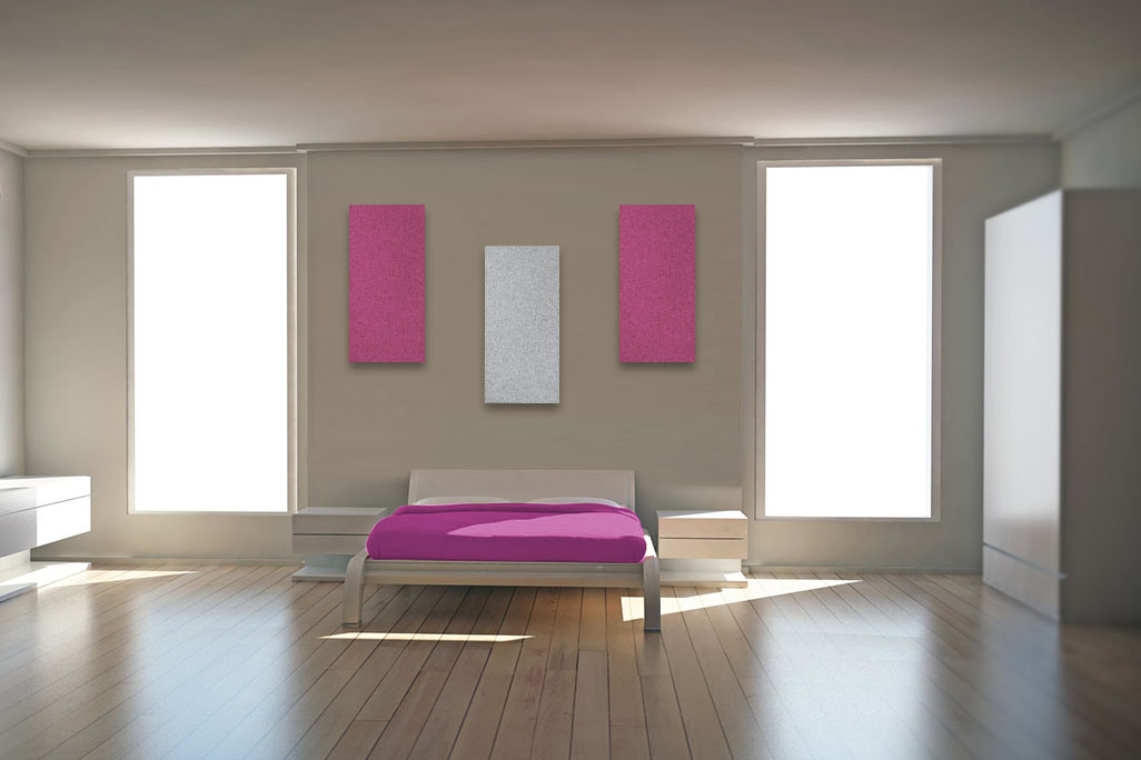 Cozy bedroom with bed, chest of drawers and window, complemented by PES fleece elements with a mottled felt surface on the wall.